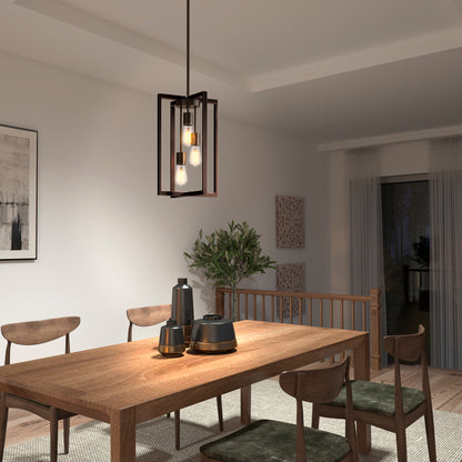 A modern dining room with a wooden table, four chairs, decorative vases, a potted plant, minimalist artwork, floor-length curtains over sliding glass doors, and the Artika Yale 3-light Chandelier as the geometric light fixture.