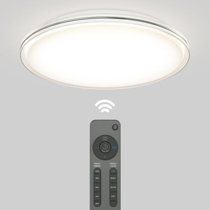 The Artika Astrid 16.5 in. LED flush mount light offers 5 CCT options and comes with a remote control for wireless operation, as shown by the illuminated fixture and signal icon above the handheld remote.