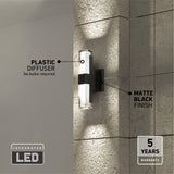 A modern wall-mounted LED light fixture with a plastic diffuser and matte black finish, casting light on a textured wall. Text highlights No bulbs required, 5 years warranty, and Integrated LED.