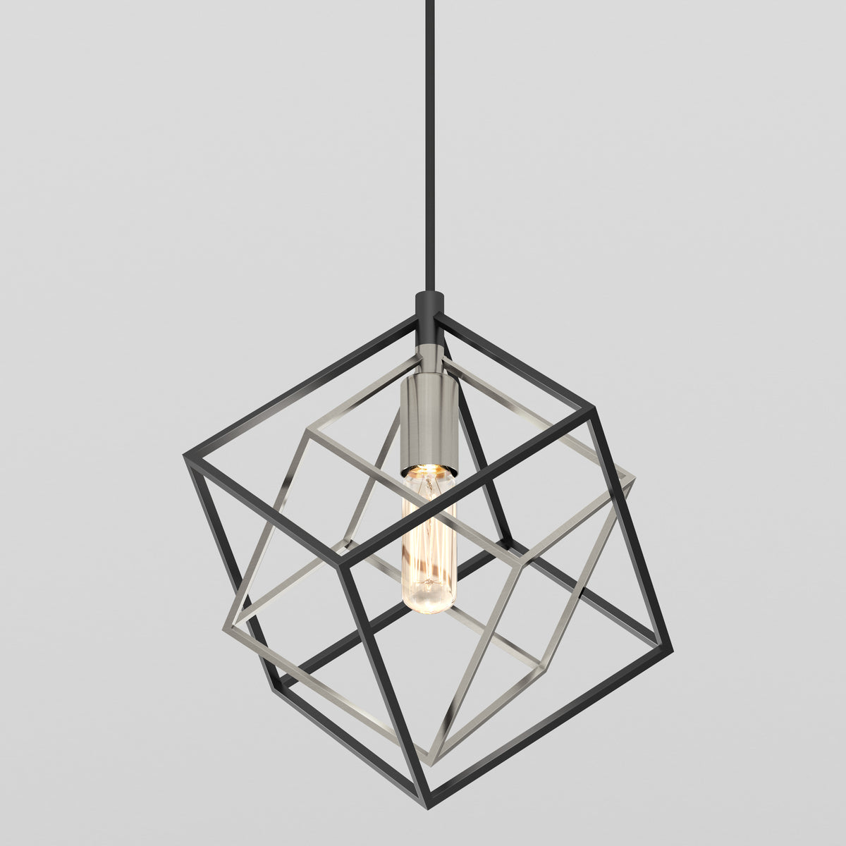 The Imperium Single pendant light by Artika features an exposed bulb within an open, geometric black metal cube frame and hangs from a black cord, set against a plain light gray background.