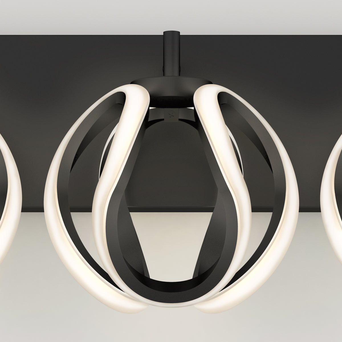 Modern ceiling light fixture with black and white curved LED strips forming a geometric, spherical shape, mounted on a flat black ceiling plate against a neutral background.