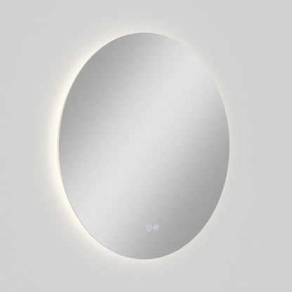The Artika-CAN-dev Raya 24 in. LED mirror features a circular, wall-mounted design with a soft backlight, two touch buttons at the bottom, defogger function, and 3 CCT options, shown against a plain light gray background.