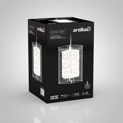 A black box with Artika branding displays the Crystal Cube 1-light LED pendant, featuring a cube design with sparkling crystal elements. Product features and technical details appear on a gray background.