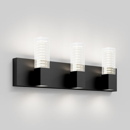 The Artika Hologram LED modern bathroom vanity light 5 CCT is a sleek black wall sconce with three rectangular lights and clear glass covers, mounted on a horizontal base for soft upward and downward lighting.