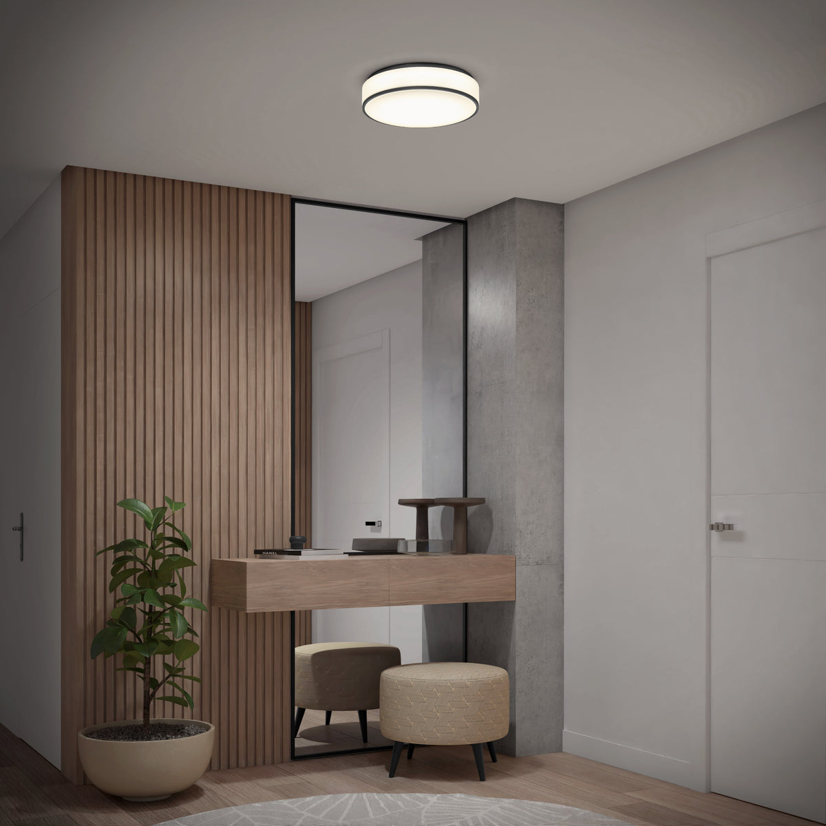 A modern entryway features a wooden accent wall, a tall mirror, a floating wooden console with decorative items, a potted plant, two round ottomans, and a ceiling light fixture.