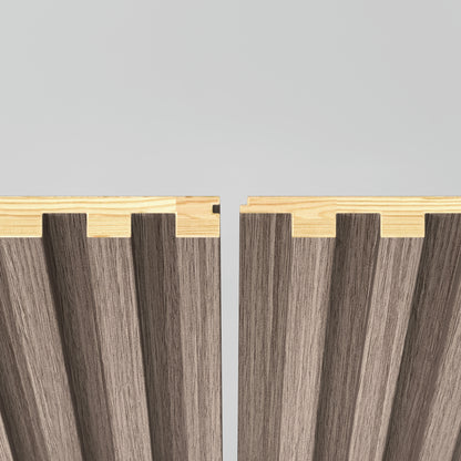 Two Artika Panolok 30.67 ft wall panels, shown from above, feature interlocking zigzag edges. The top sections are light wood; the lower sections have a darker, ribbed design. Theyre placed closely together but not yet connected. (Pack of 8).