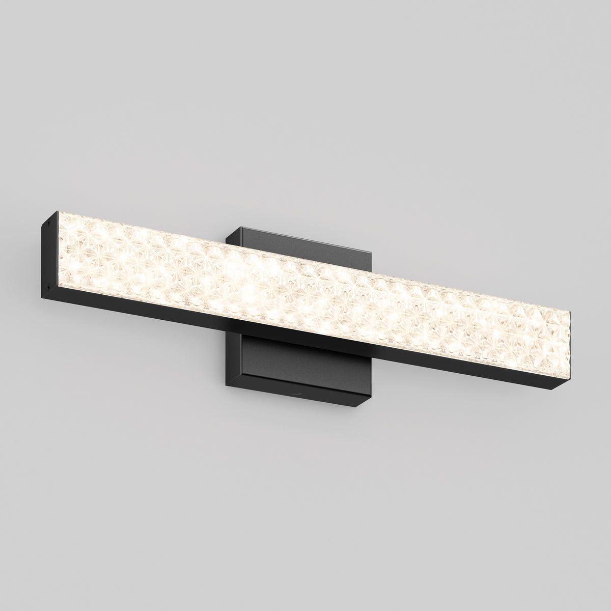 The Adeline 18-in LED Vanity Light Bar by Artika features adjustable color temperature and a textured front panel with black base.