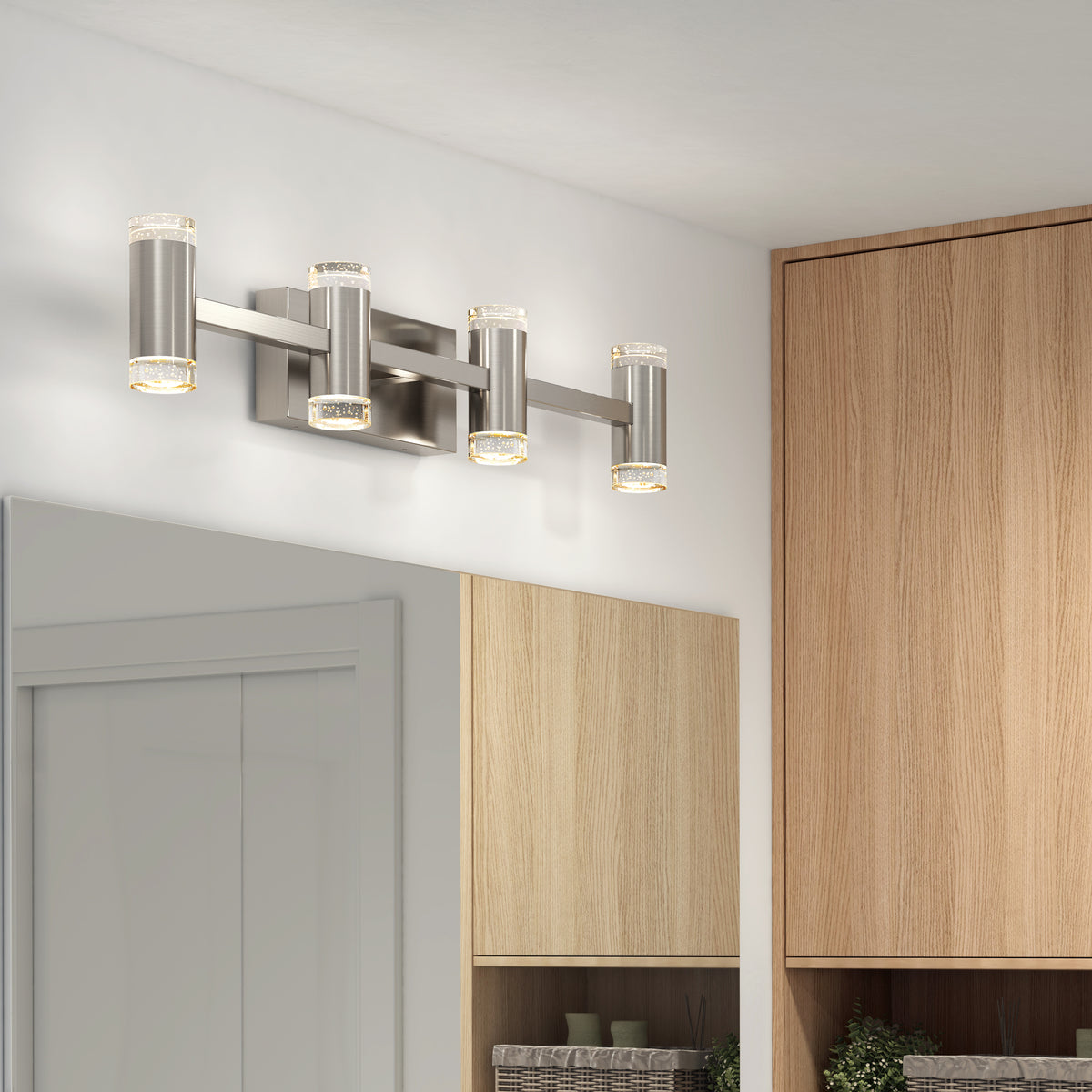 The Artika Mist modern LED bathroom vanity light 5 CCT features four cylindrical lights in brushed nickel, adjustable color temperature, and offers a stylish, sleek alternative to an LED wall sconce above large mirrors.