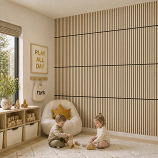 Two kids play with wooden toys as Artika's Sonolok sound-absorbing wall panel kit adds style and comfort to the cozy room.