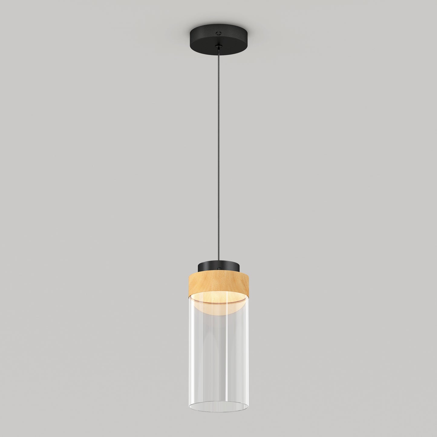 The Artika Hanson 1-light LED pendant 5 CCT features a black ceiling mount, black cord, wooden accent, and clear cylindrical glass shade, shown against a plain light gray background.