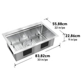 Angled view of a stainless steel kitchen sink with grid, showing dimensions: 83.82 cm (33 in) length, 55.88 cm (22 in) width, and 22.86 cm (9 in) depth.