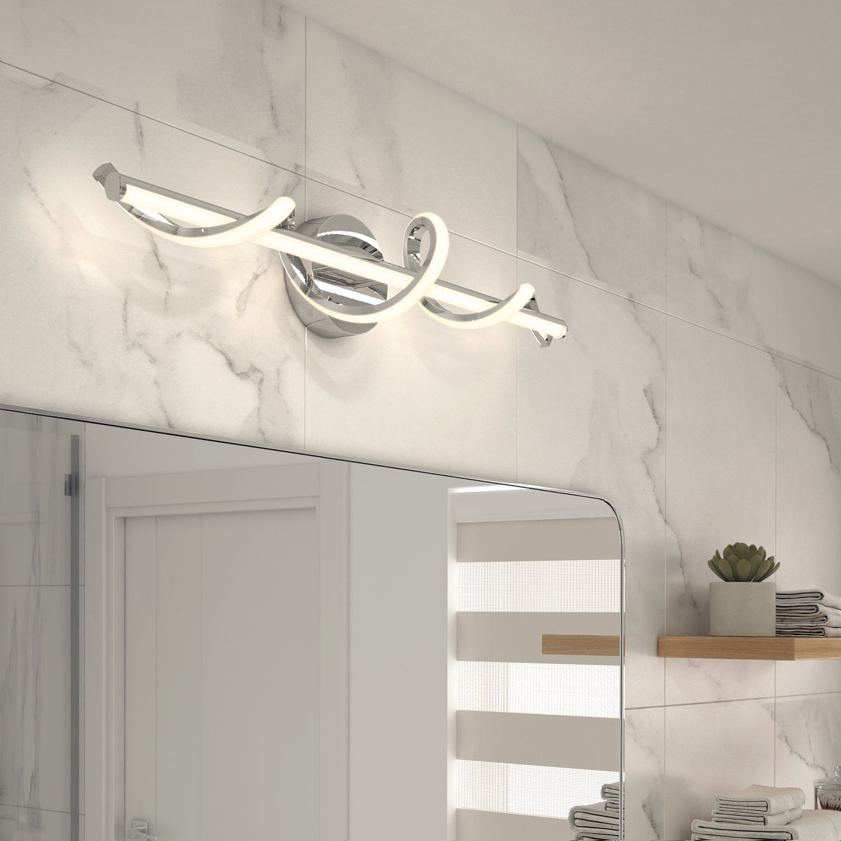 A modern bathroom features a chrome and LED swirl vanity light above a mirror, set against white marble-patterned tile walls. Floating wooden shelves with decor are visible to the right.