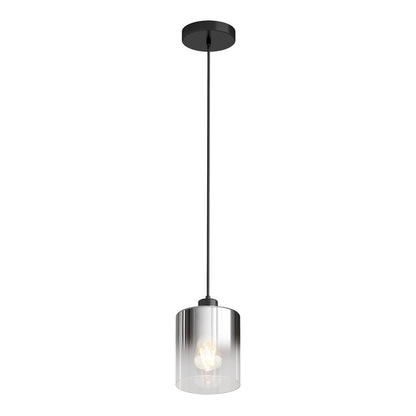 The Artika Haze pendant light glass features a sleek black ceiling mount, a long black cord, and a cylindrical clear glass shade that showcases the glowing bulb inside.
