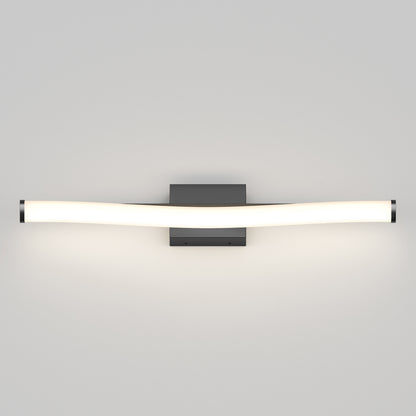 The Artika Arc modern LED bathroom vanity light 5 CCT features a sleek, wall-mounted design with a curved white light bar and rectangular dark base, casting illumination on neutral walls.