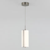 A modern pendant light with a cylindrical white shade and metallic accents, suspended from the ceiling by a thin cord against a plain light gray background.