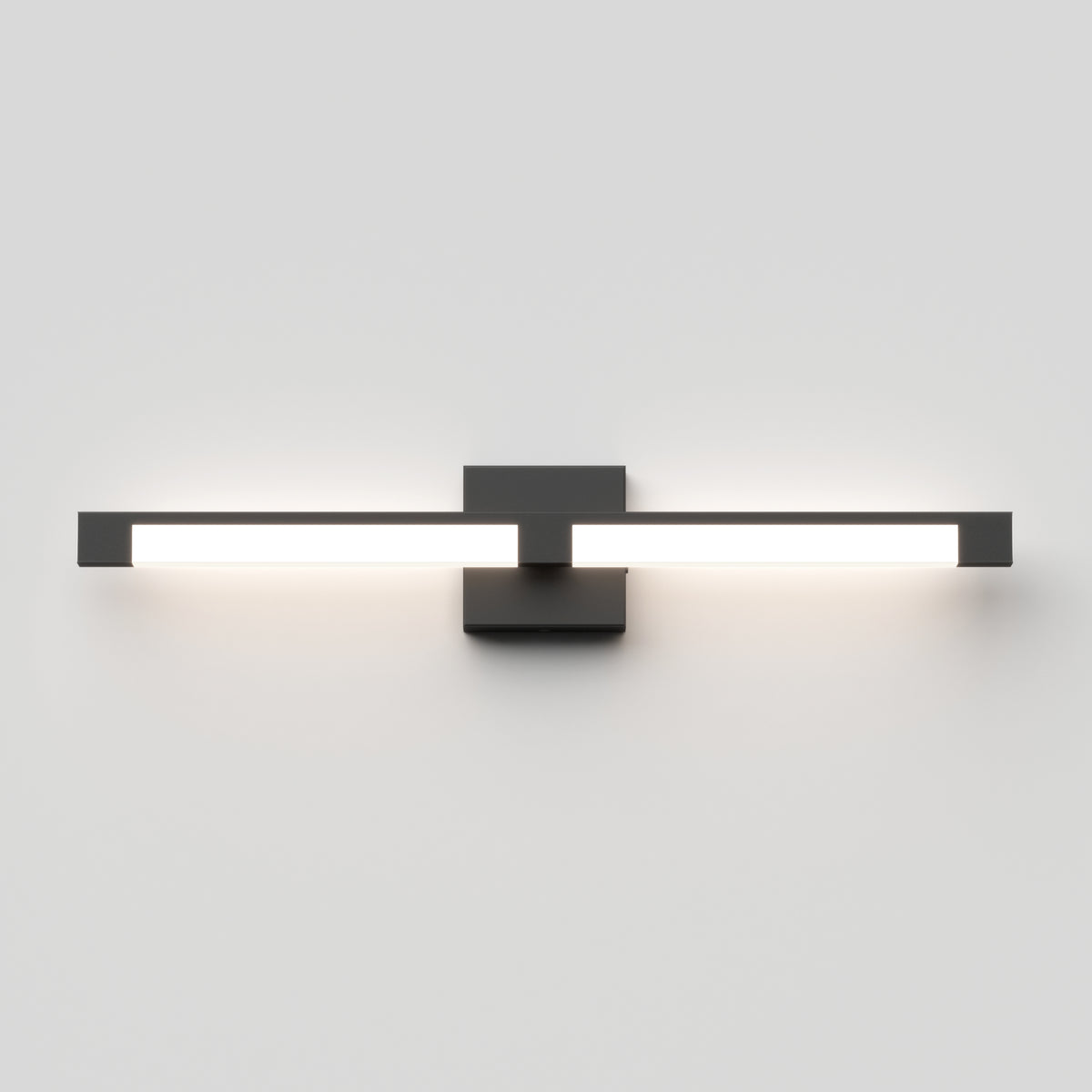 The Artika Tivoli modern LED bathroom vanity light 5 CCT features a sleek black base and two horizontal bars with adjustable lighting and LED dimmer, casting a soft white glow on a plain white wall.