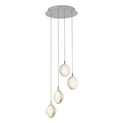 The Artika Avalon 4-light LED pendant features four round glass fixtures with crystal-like patterns, suspended at varying heights from a round metal base for a modern look.