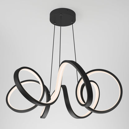 The Artika-CAN-dev Swirl Ribbon LED pendant light features three looping black rings in a swirl design, suspended by thin cords from a round ceiling mount. Integrated LEDs emit a soft white glow from the inner edges.