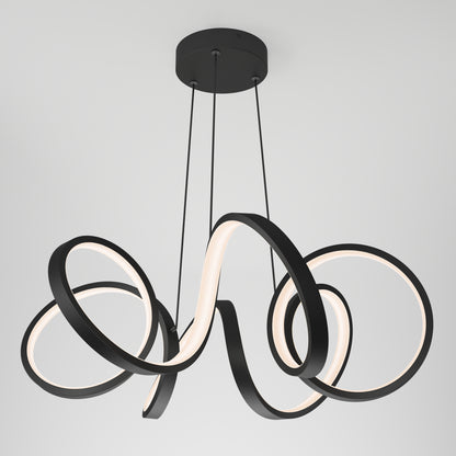 The Artika Swirl Ribbon LED pendant light features three intertwined black metal loops with integrated LEDs, suspended by slim black cords from a circular base, creating a modern ceiling fixture.