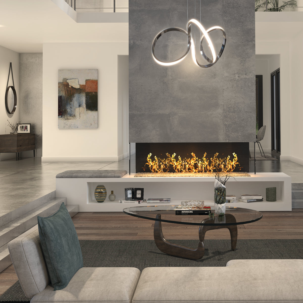 A modern living room with a glass coffee table, light sectional sofa, contemporary fireplace with yellow flames, minimalist decor, abstract wall art, and the Artika Swirl LED pendant light looping gracefully above.