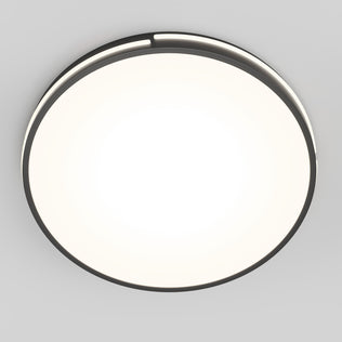 The Artika Delray 15.7 in. LED modern flush mount light features a round design with a black rim and bright white center, seamlessly mounted on a light gray ceiling.