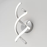 A modern wall-mounted LED light fixture featuring two intertwined, curved metallic strips—one illuminated—against a plain white background.