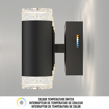 The Artika Mist modern LED bathroom vanity light 5 CCT, shown in sleek black with a cylindrical design and sparkling glass ends, appears side-on. A color temperature switch icon and multilingual labels are displayed below.