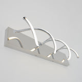 A modern chrome wall light fixture with three curved, illuminated LED arms arranged in an artistic, wave-like design on a rectangular base.