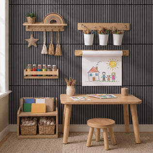 A child’s art corner with a small desk, supplies, baskets, and Artika Sonolok sound-absorbing wall panels for a creative space.