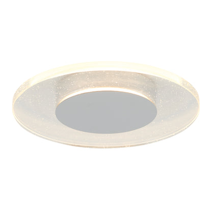 The Artika Essence Disk LED flush mount features a modern round design with a frosted, sparkle-accented outer ring and a smooth reflective center, emitting a soft, even glow.