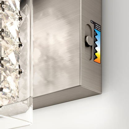 A close-up of the Artika Crystal Cube LED bathroom vanity light 5 CCT, featuring a textured glass element on the left and a color temperature adjustment dial with a warm-to-cool gradient label on the right.