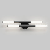 A modern wall light fixture with two parallel, cylindrical LED tubes in black and white, mounted on a round black base against a plain grey background.