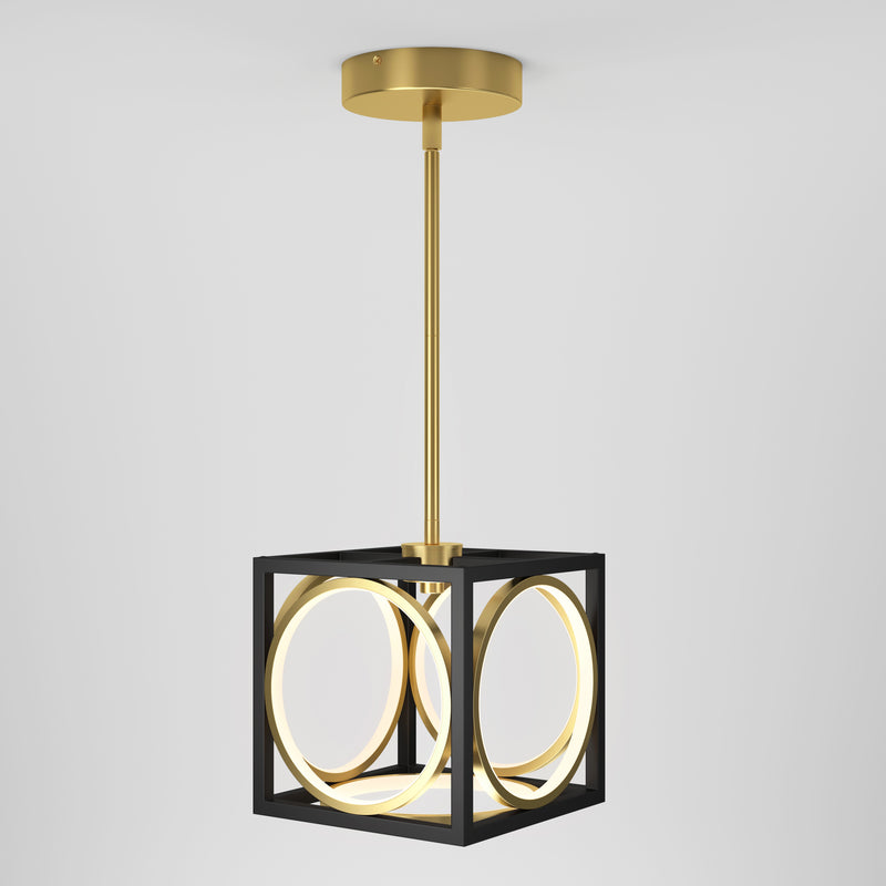 The Astoria LED modern pendant light by Artika features a gold rod and canopy, a black cubic frame, and glowing circular LED rings, suspended against a plain white background.