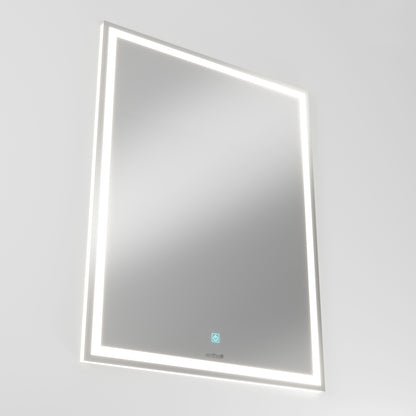 The Artika Emeraude dimmable LED mirror 3 CCT is a rectangular, wall-mounted mirror featuring illuminated LED strips around the edges and a touch sensor at the bottom center, shown against a plain white background.