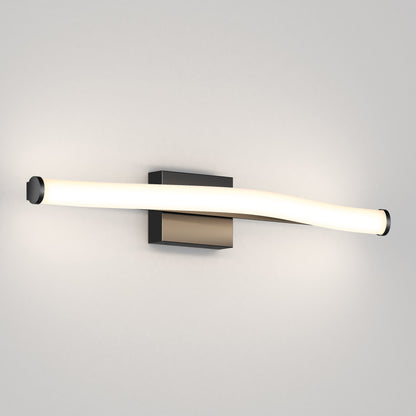 The Artika Arc modern LED bathroom vanity light 5 CCT features a gently curved illuminated tube and rectangular metallic base, providing soft lighting on a white wall.
