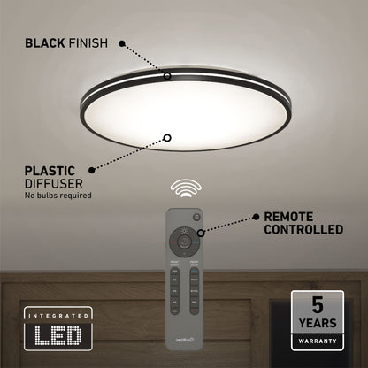 The Artika Athos 21 in. LED flush mount light, shown with a black finish and plastic diffuser, includes a remote control. Features: integrated LEDs (no bulbs needed), remote operation, and a 5-year warranty.