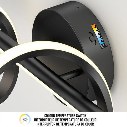 The Artika Coda modern LED bathroom vanity light features a black circular design with a glowing LED ring and a Colour Temperature Switch, letting you adjust the light from warm yellow to cool blue with 5 selectable color temperatures.