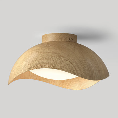 Adara 15 in. (38 cm) Modern LED Flush Mount Ceiling Light 5 CCT with a curved light-wood shade and a circular frosted glass center.