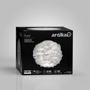 A box for the Artika Plume LED flush mount light displays a feather-like white fixture image on the front, with product name and specifications printed on the packaging.