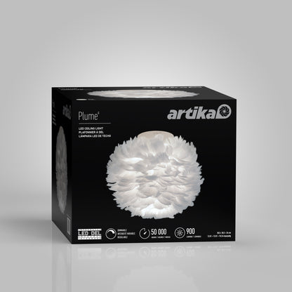 A box for the Artika Plume LED flush mount light displays a feather-like white fixture image on the front, with product name and specifications printed on the packaging.