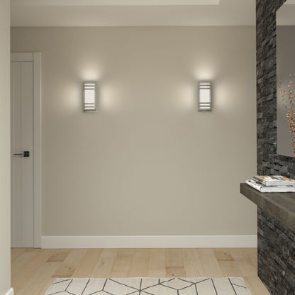 A minimalist hallway with light wood floors, a beige wall featuring two modern wall sconces, a white door on the left, a geometric rug, and a floating stone shelf with magazines and a vase.