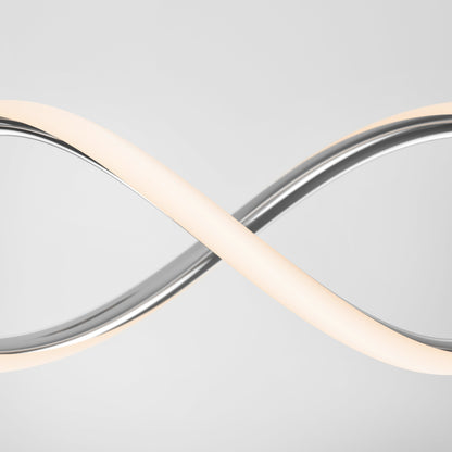 The DNA Linear LED modern pendant light by Artika-CAN-dev features intertwined metallic and illuminated bands with integrated LEDs, crafted in a sleek infinity shape, set against a plain light gray background.