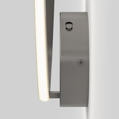 Close-up side view of the Artika Gamma modern LED wall sconce 5 CCT, featuring a brushed metal finish, illuminated edge, and visible mounting screws against a plain light gray background.