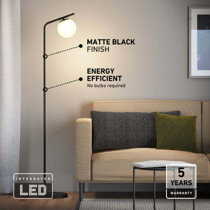 Artika Clayton dimmable LED modern mid-century floor lamp in matte black with a spherical white glass shade, energy efficiency labels, and warranty.