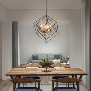 A modern dining room features a wooden table, six chairs, and the Artika Harmonium modern mid-century pendant light overhead. In the background, a cozy living area with a gray sofa and coffee table completes the minimalist, elegant decor.