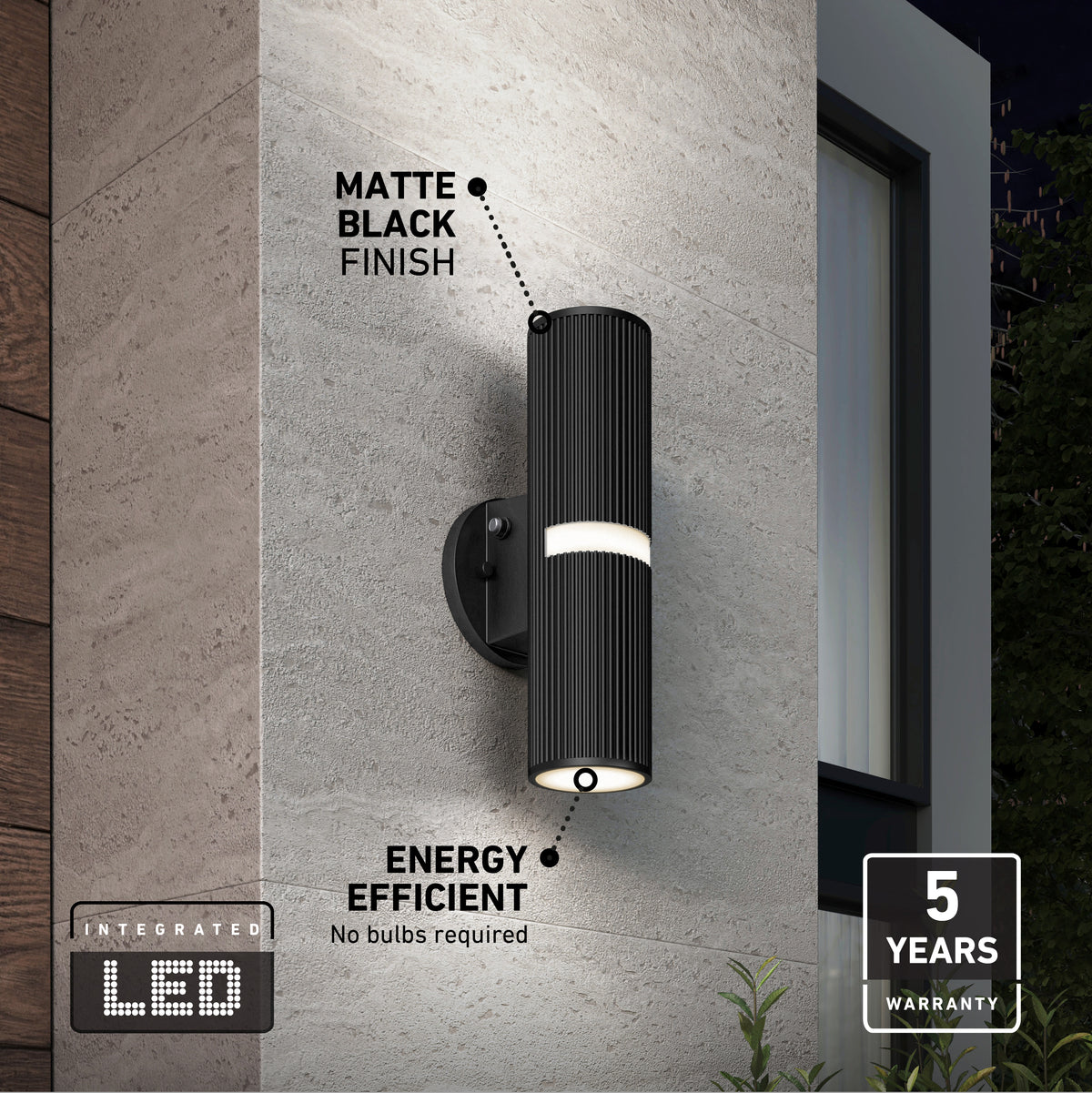 The Artika Groove LED indoor-outdoor wall light, shown in matte black on a gray wall near a window, features energy efficiency, a 5-year warranty, and integrated LEDs—no bulbs required.