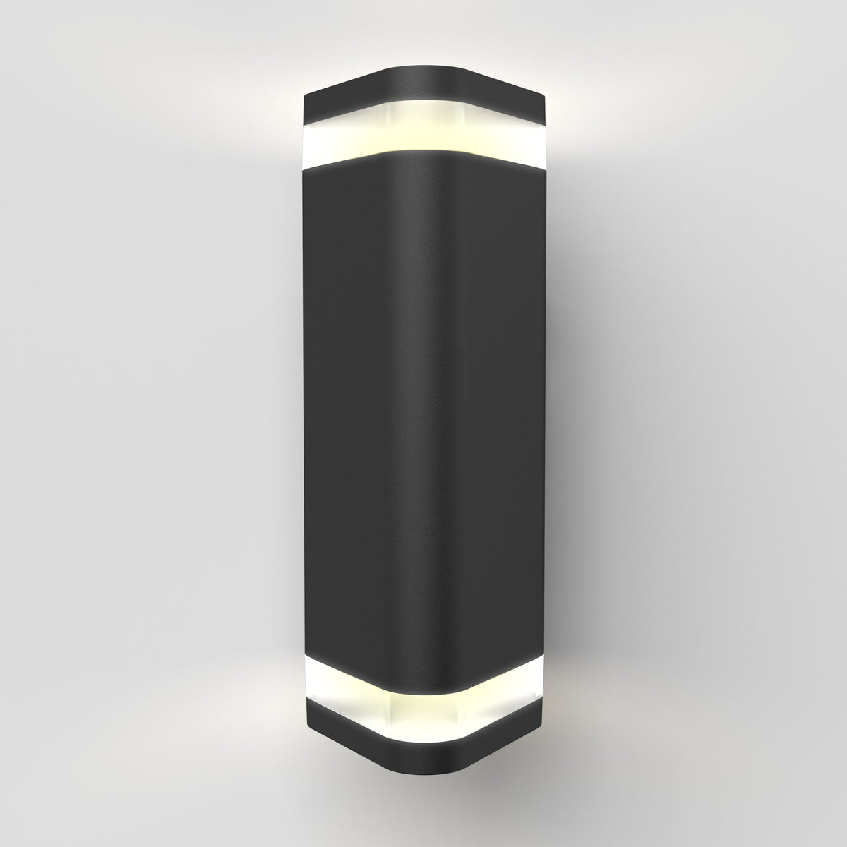 A modern black wall sconce light fixture with a rectangular shape and rounded edges, emitting white light from both the top and bottom against a plain white wall.