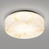 A round, flush-mount ceiling light with a marble-like, translucent white and beige shade is illuminated against a plain, light gray ceiling.