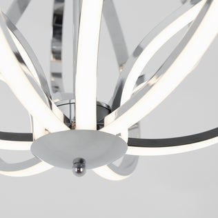 Close-up of the Artika Meridian LED pendant light, featuring curved chrome-finished arms and integrated LED strips, set against a white background—a striking piece of contemporary lighting.