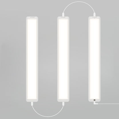 Three Artika Maestro under cabinet LED light 3CCT bars are mounted vertically in a zigzag pattern with white cables against a plain light gray background.